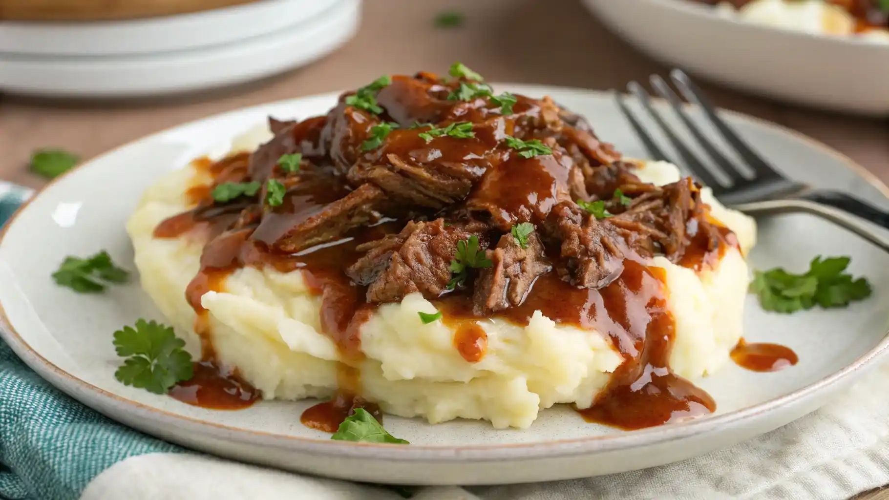 Instant Pot BBQ beef served over mashed potatoes